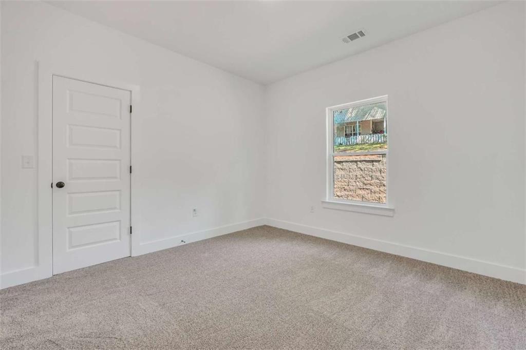 65 Lakeside Drive Covington, GA 30016 - Photo 24 of 35 an empty room with windows