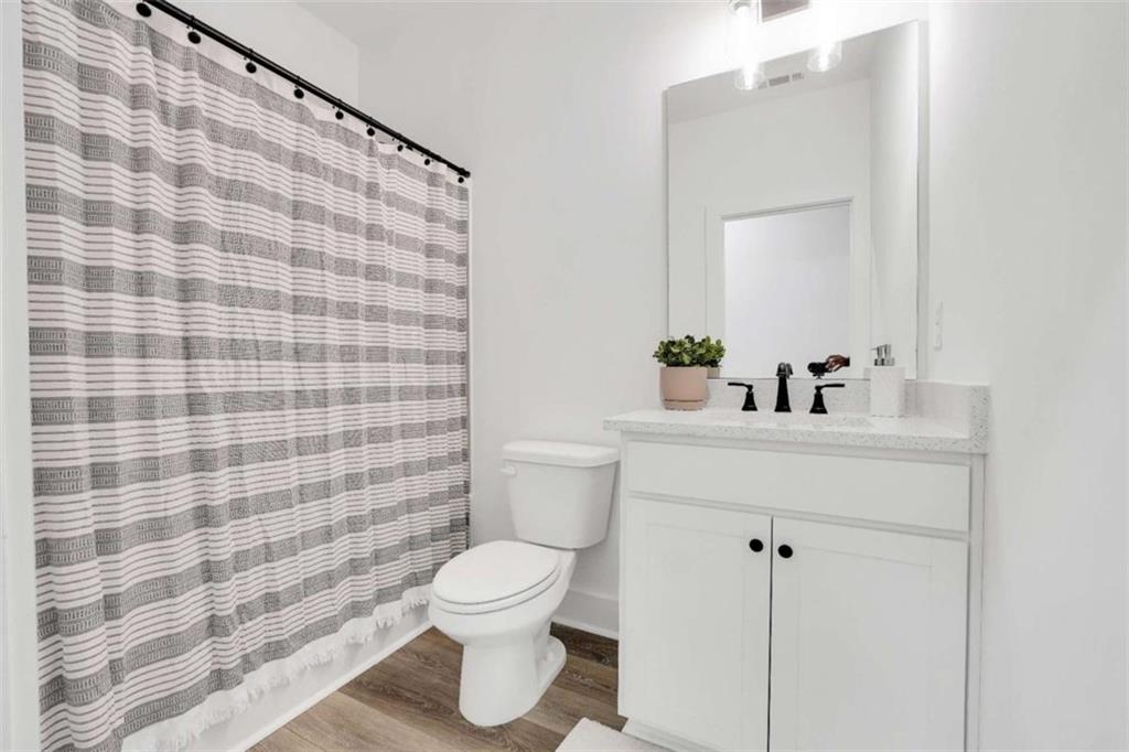 65 Lakeside Drive Covington, GA 30016 - Photo 25 of 35 a bathroom with a sink and a toilet