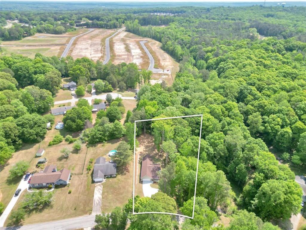 65 Lakeside Drive Covington, GA 30016 - Photo 35 of 35 an aerial view of residential houses with outdoor space and trees