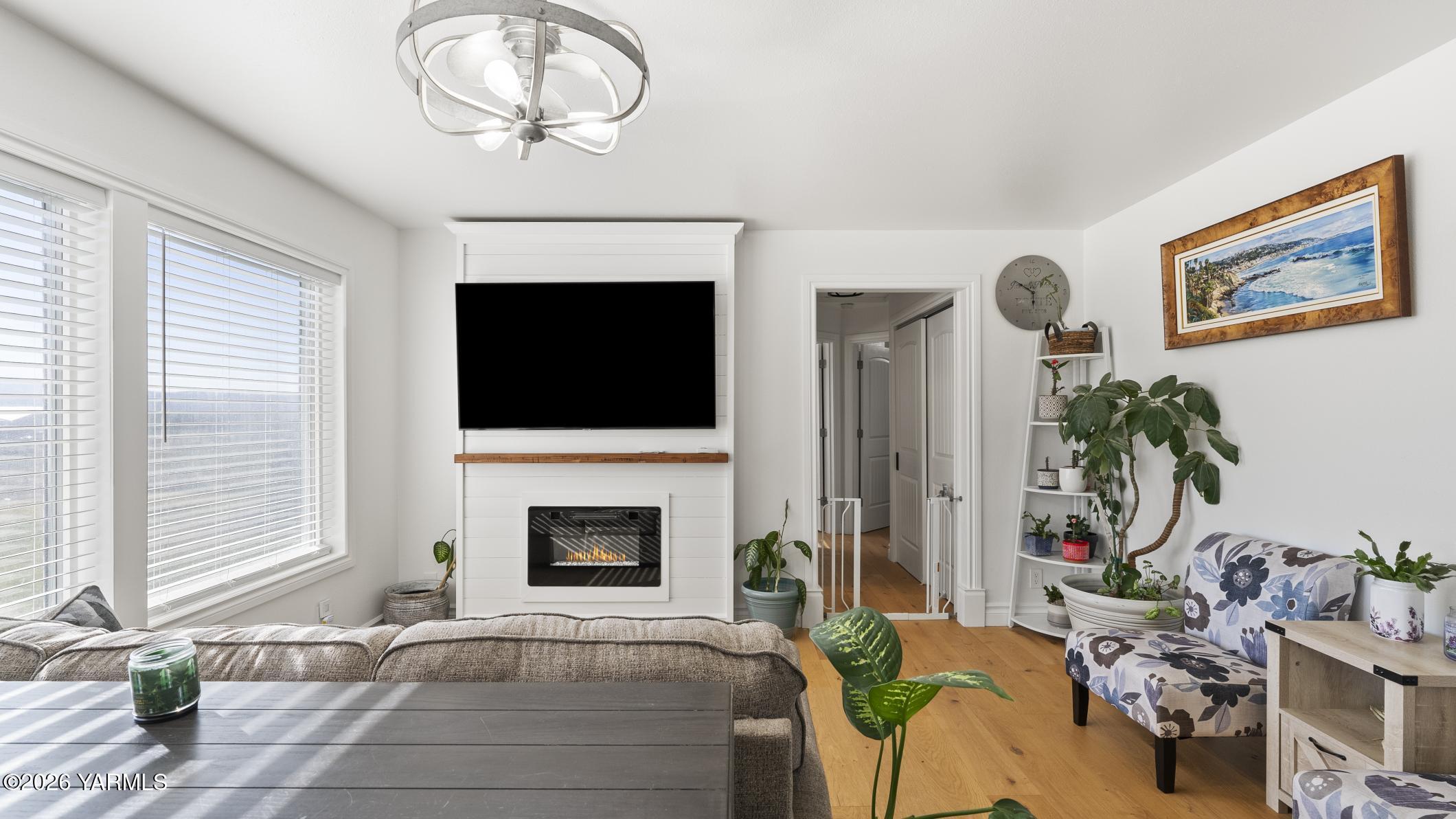 471 Gibson Road Selah, WA 98942 - Photo 5 of 13 a living room with furniture a fireplace and a flat screen tv