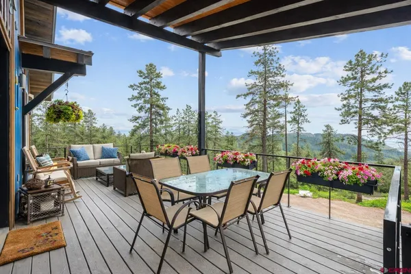 a dining room with furniture and wooden floor