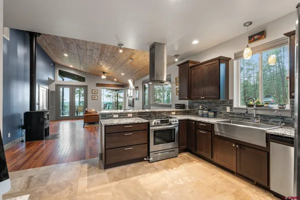 a bedroom with a large bed and a large window
