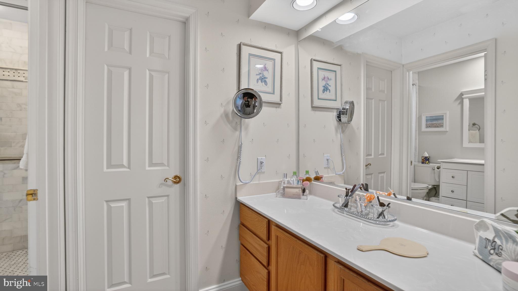 317 Canterfield Road Annapolis, MD 21403 - Photo 30 of 66 a bathroom with a sink and a mirror