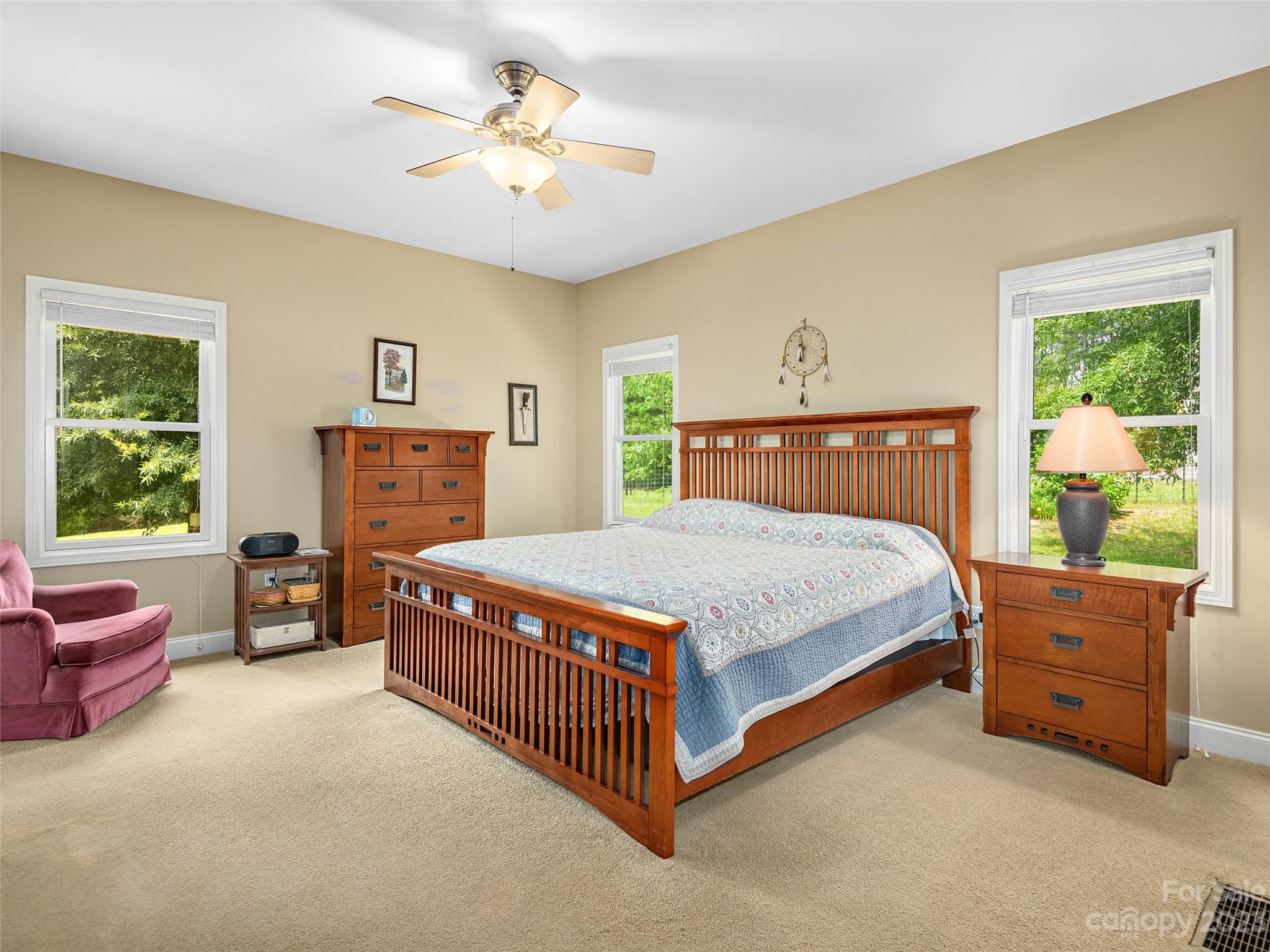 1223 North Ridge Road Hendersonville, NC 28792 - Photo 12 of 24 a bedroom with a bed dresser and a window