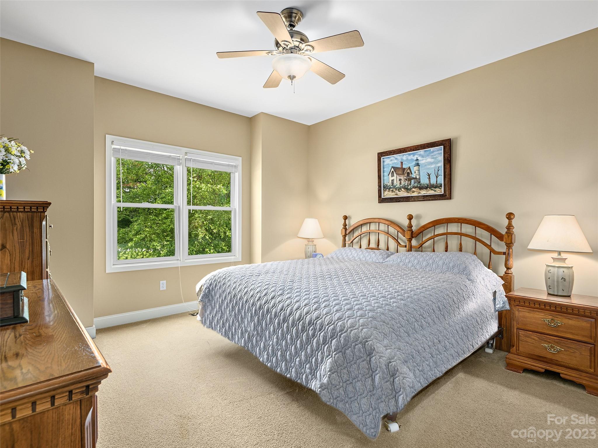 1223 North Ridge Road Hendersonville, NC 28792 - Photo 17 of 24 a bedroom with a bed and a window