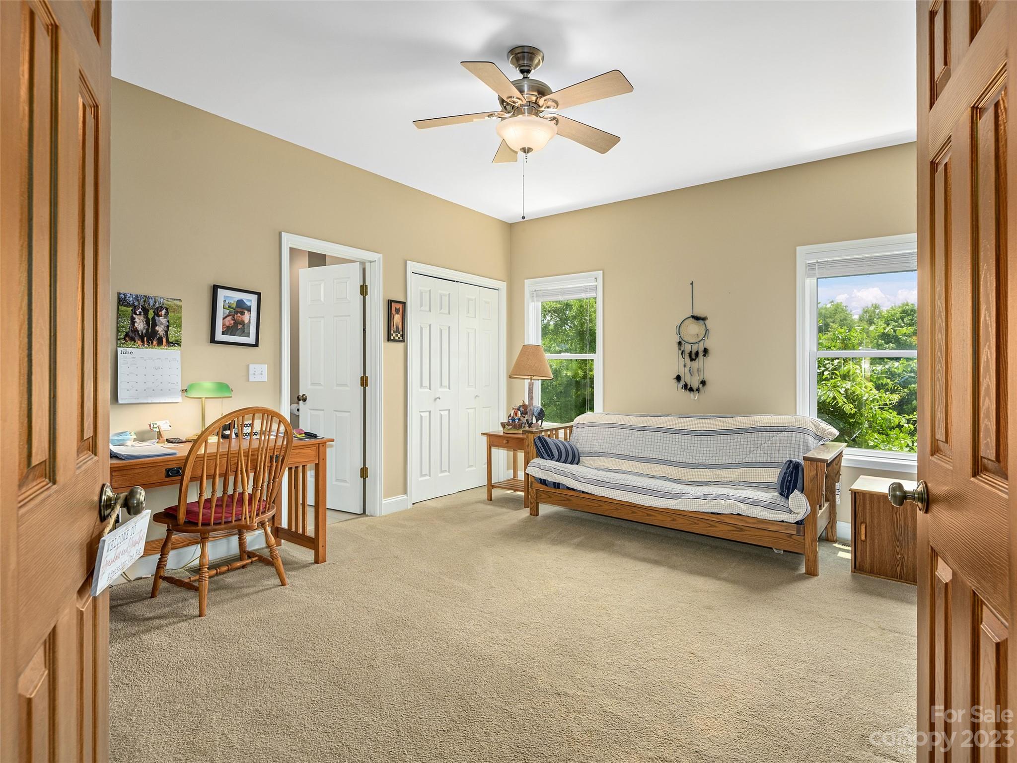 1223 North Ridge Road Hendersonville, NC 28792 - Photo 20 of 24 a bedroom with furniture and a window