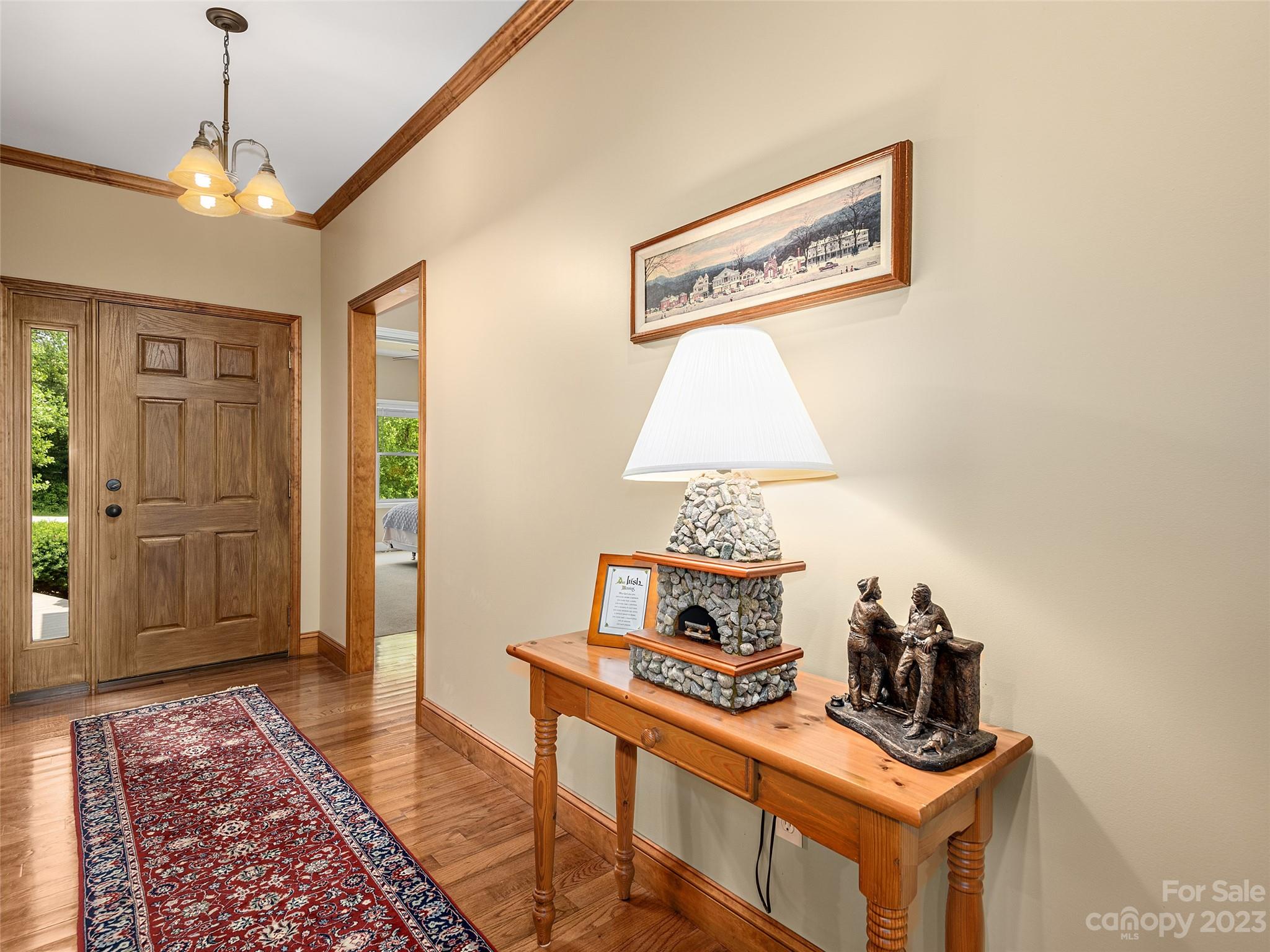 1223 North Ridge Road Hendersonville, NC 28792 - Photo 5 of 24 a room with furniture and wooden floor
