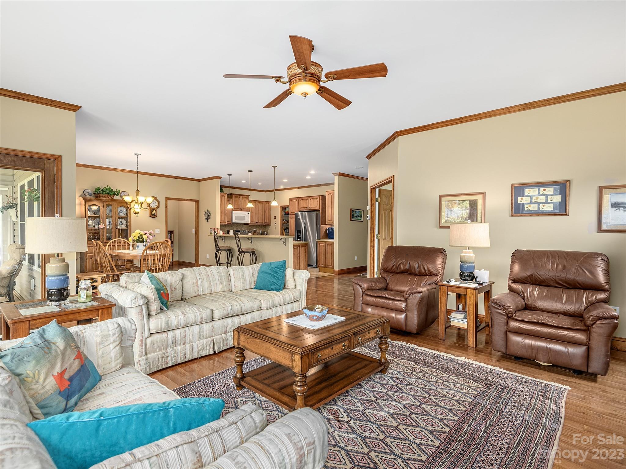 1223 North Ridge Road Hendersonville, NC 28792 - Photo 7 of 24 a living room with furniture ceiling fan and a rug