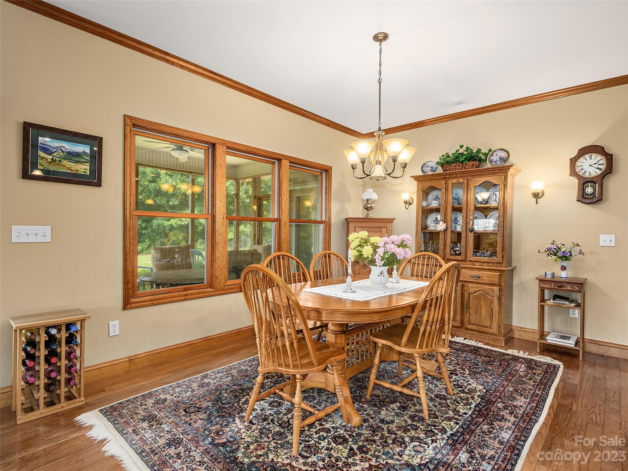 1223 North Ridge Road Hendersonville, NC 28792 - Photo 8 of 24 a view of a dining room with furniture window and wooden floor