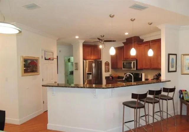 a view of a kitchen from a dining room