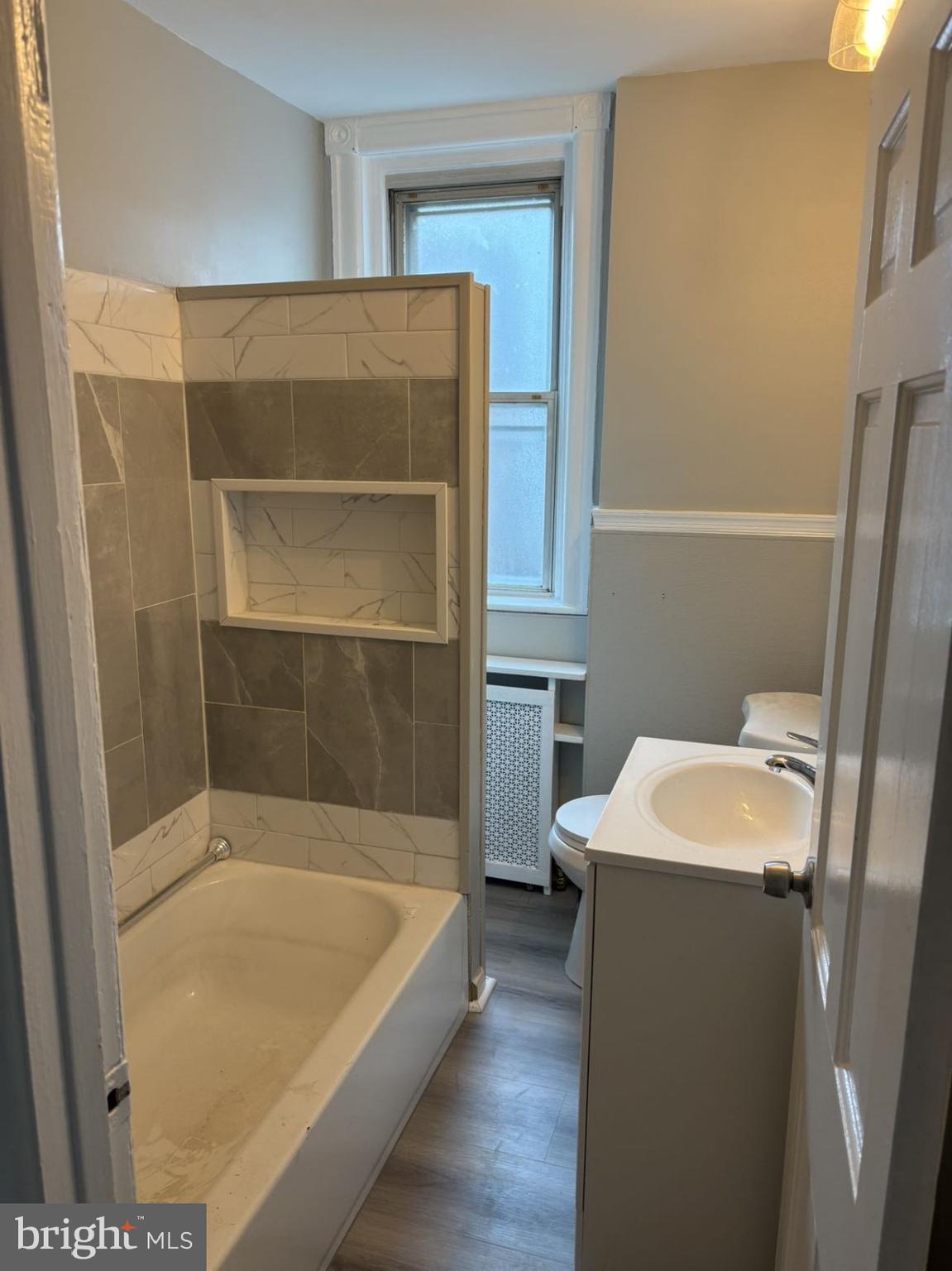 4007 Higbee Street Philadelphia, PA 19135 - Photo 11 of 20 a bathroom with a tub and a sink