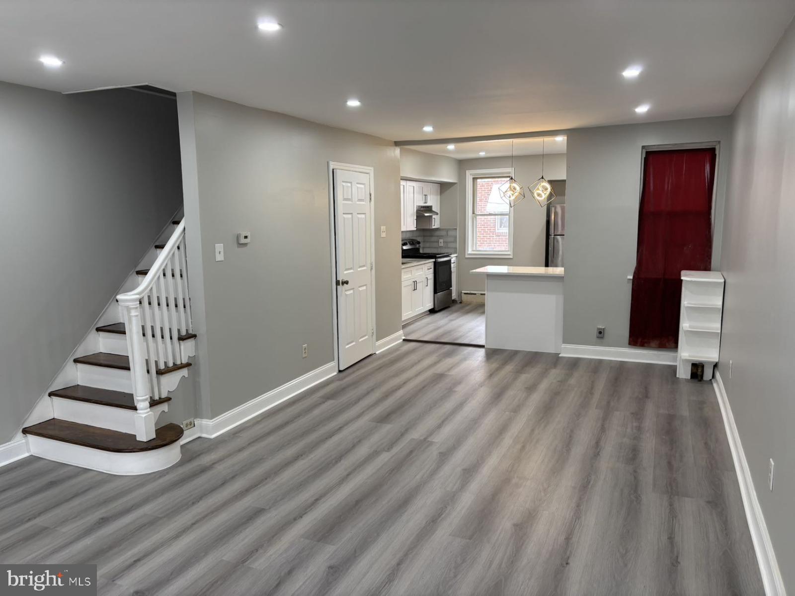 4007 Higbee Street Philadelphia, PA 19135 - Photo 14 of 20 a view of a hallway with stairs and a window