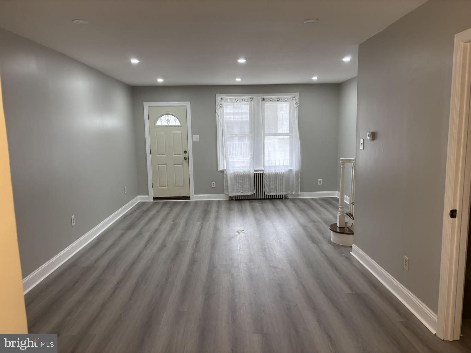 4007 Higbee Street Philadelphia, PA 19135 - Photo 17 of 20 a view of a room with wooden floor and window