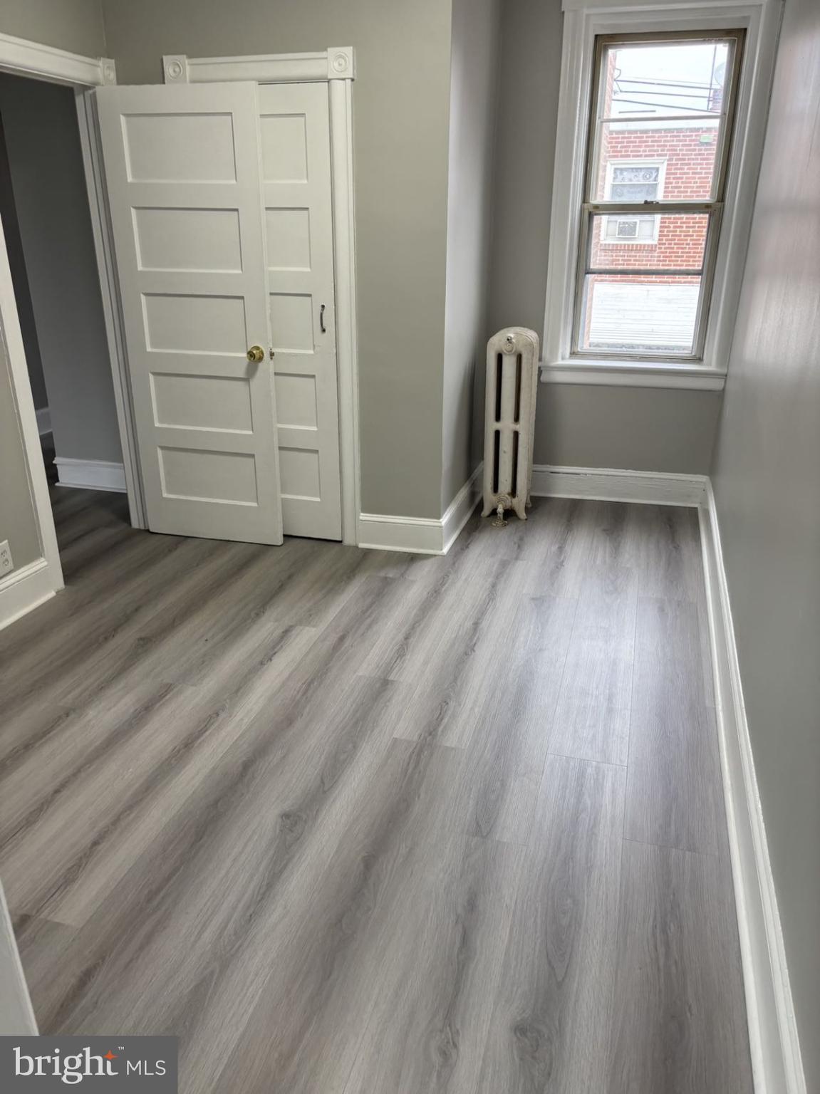 4007 Higbee Street Philadelphia, PA 19135 - Photo 8 of 20 a view of room with window and hardwood floor