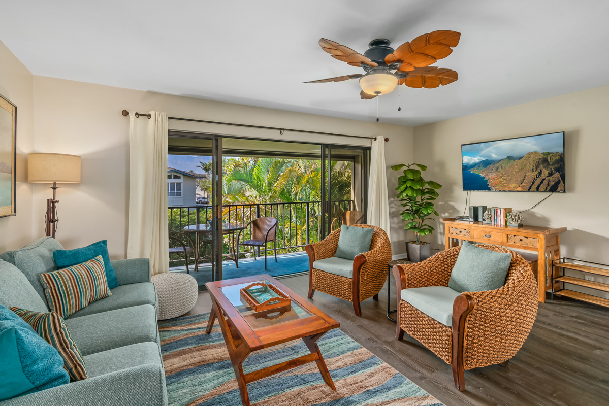 3830 Edward Road, Unit 9F Princeville, HI 96722 - Photo 11 of 20 a living room with furniture and a large window
