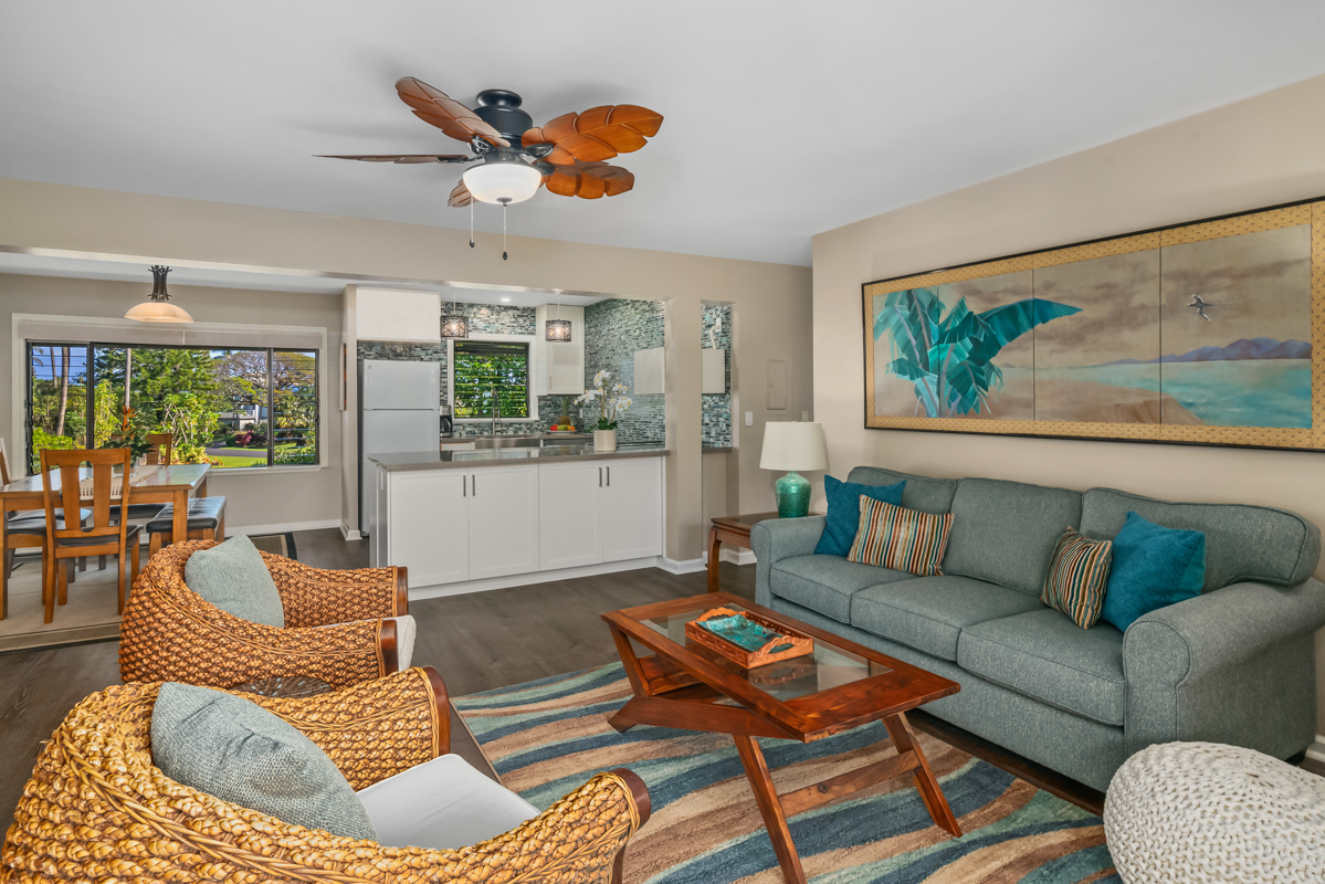 3830 Edward Road, Unit 9F Princeville, HI 96722 - Photo 14 of 20 a living room with furniture and a large window