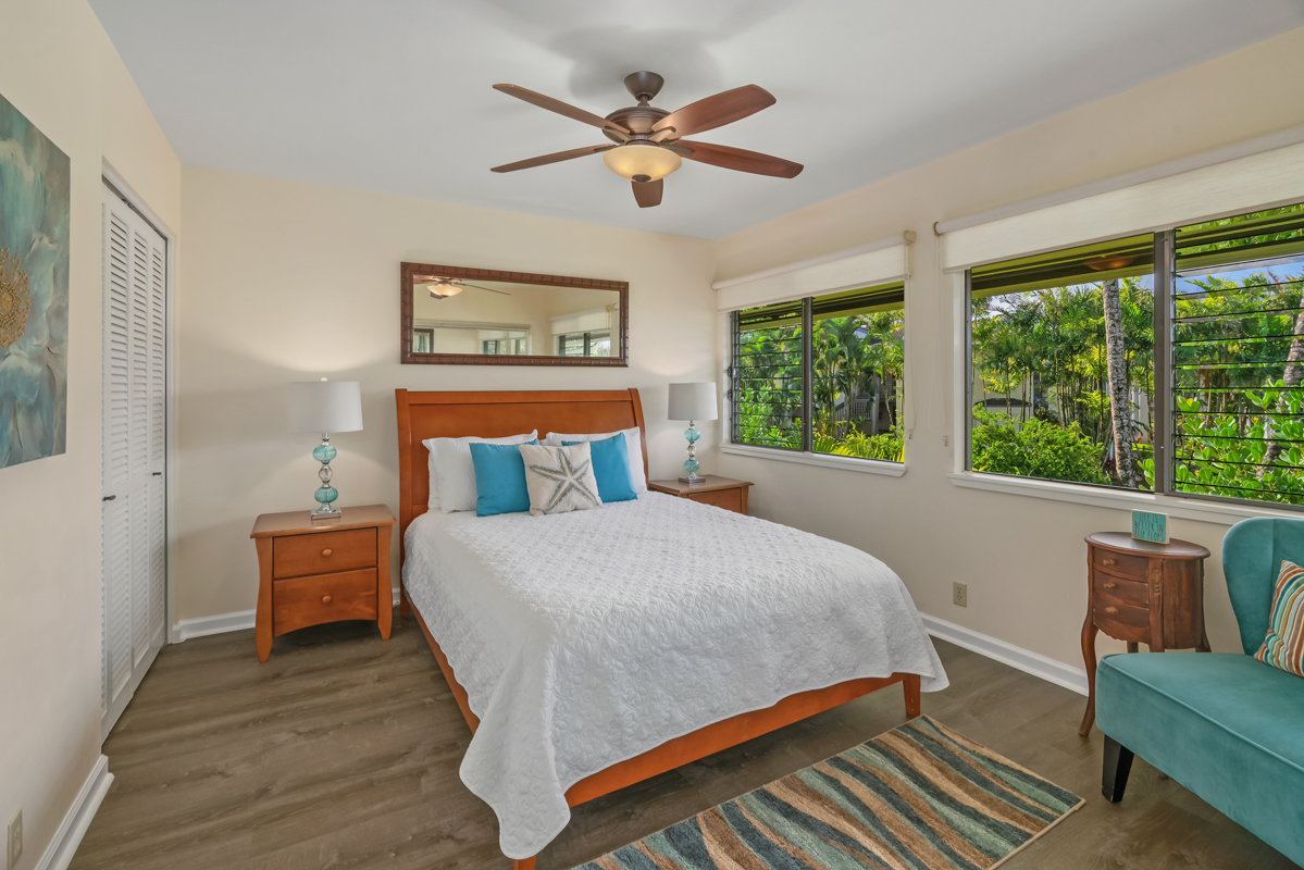 3830 Edward Road, Unit 9F Princeville, HI 96722 - Photo 15 of 20 a bedroom with a bed and window