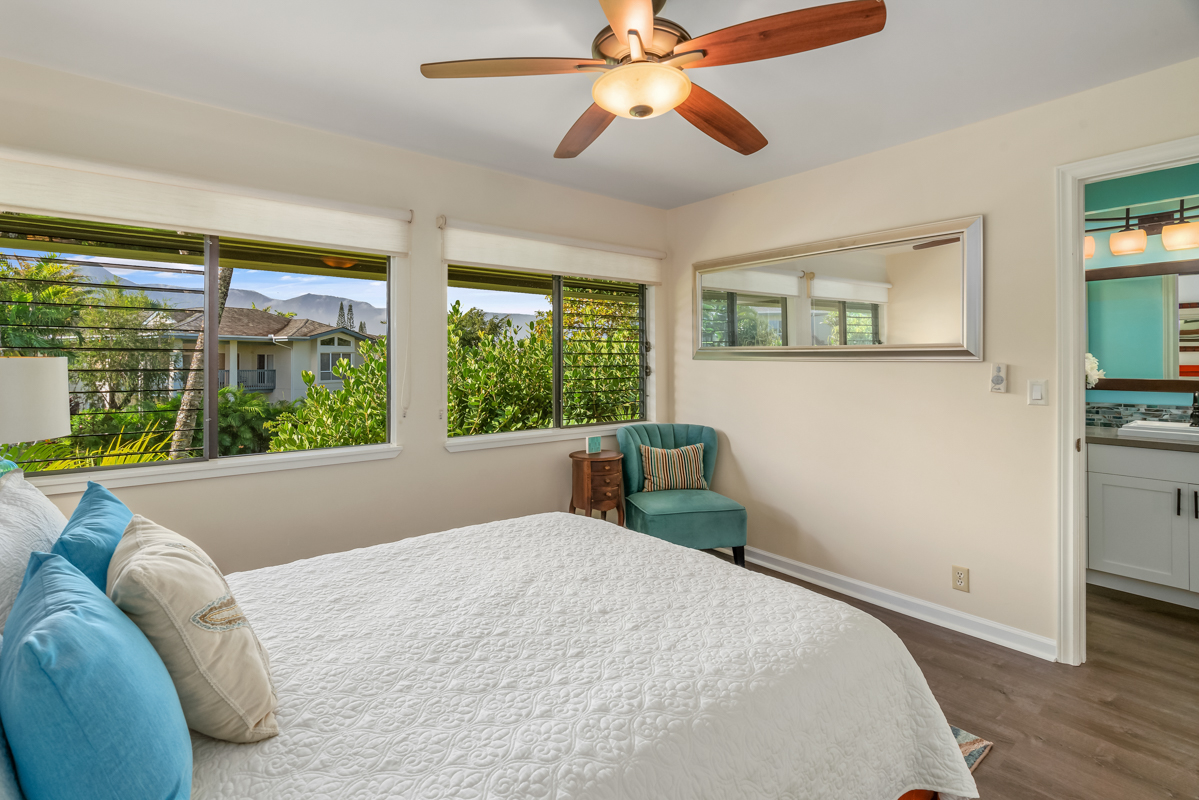3830 Edward Road, Unit 9F Princeville, HI 96722 - Photo 16 of 20 a bed sitting in a bedroom next to a window