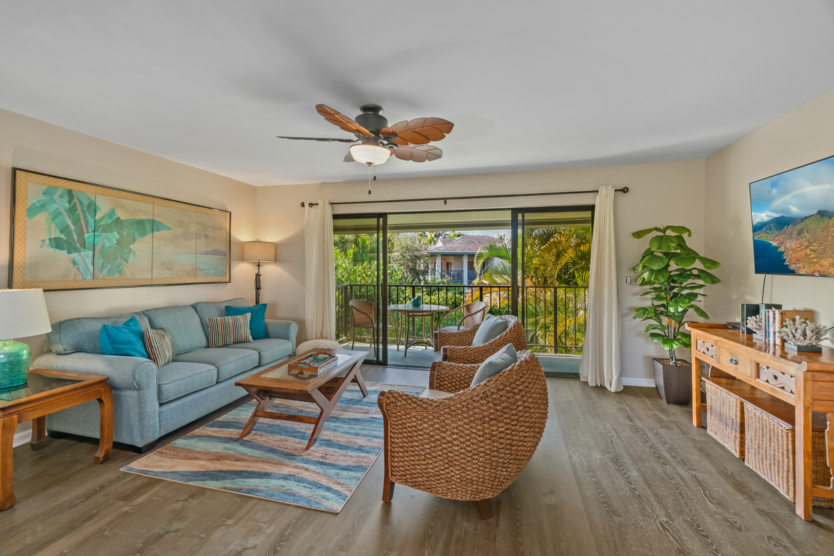 3830 Edward Road, Unit 9F Princeville, HI 96722 - Photo 2 of 20 a living room with furniture and a large window
