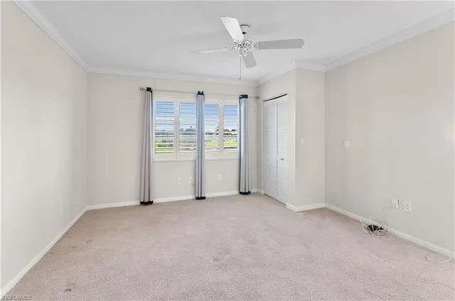 an empty room with a empty space and windows