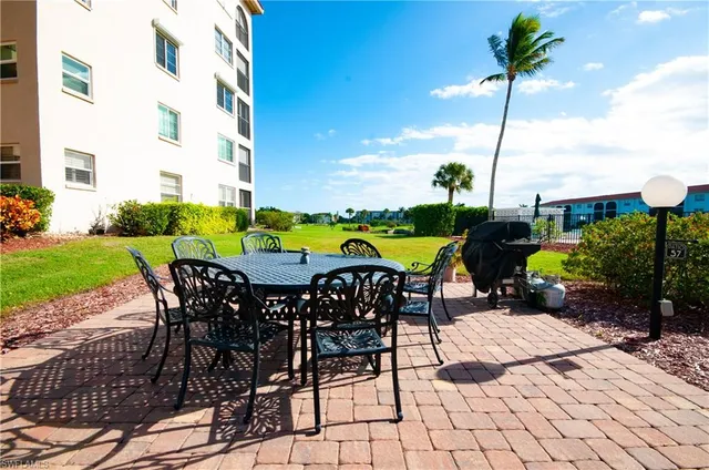 a view of a chairs and table in the patio