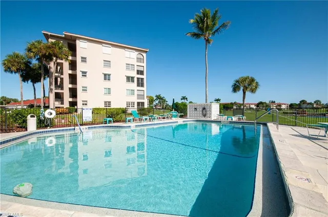 a view of swimming pool from a balcony