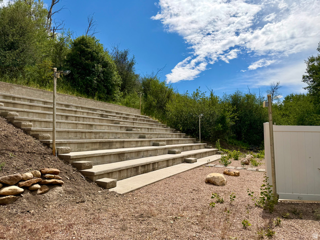 1133 Paris Canyon Road Paris, ID 83261 - Photo 43 of 75 Terraced concrete seating amphitheater with integrated lighting, surrounded by established greenery and a gravel base