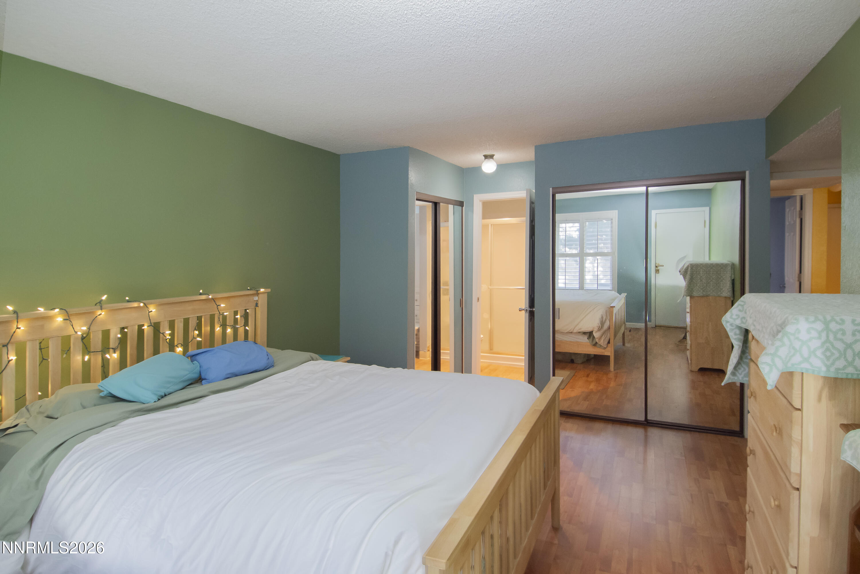 2317 Roundhouse Road Sparks, NV 89431 - Photo 12 of 14 a bedroom with a bed and large windows