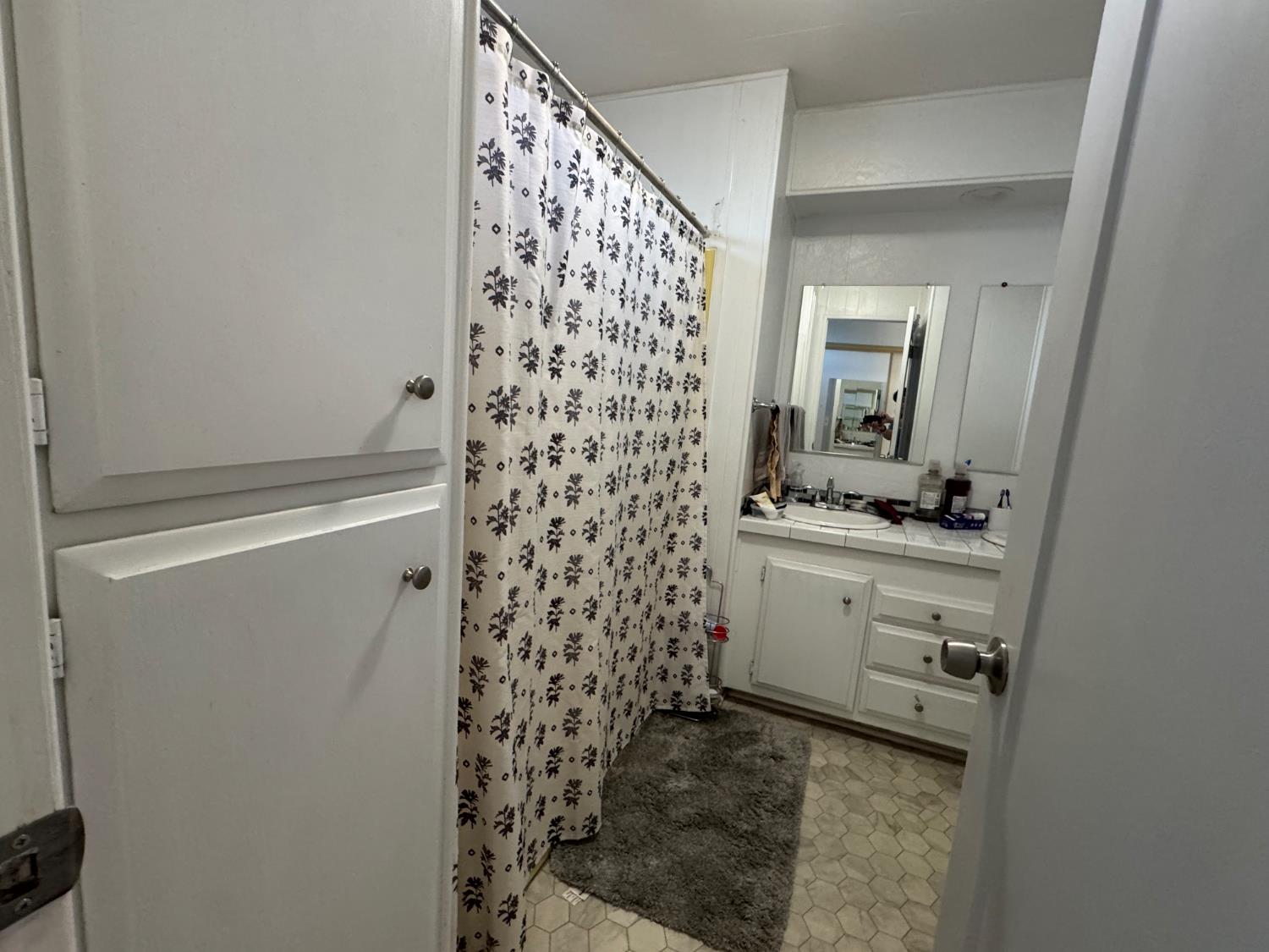 10035 Mills Station Road, Unit 161 Sacramento, CA 95827 - Photo 14 of 15 a bathroom with a sink toilet and shower