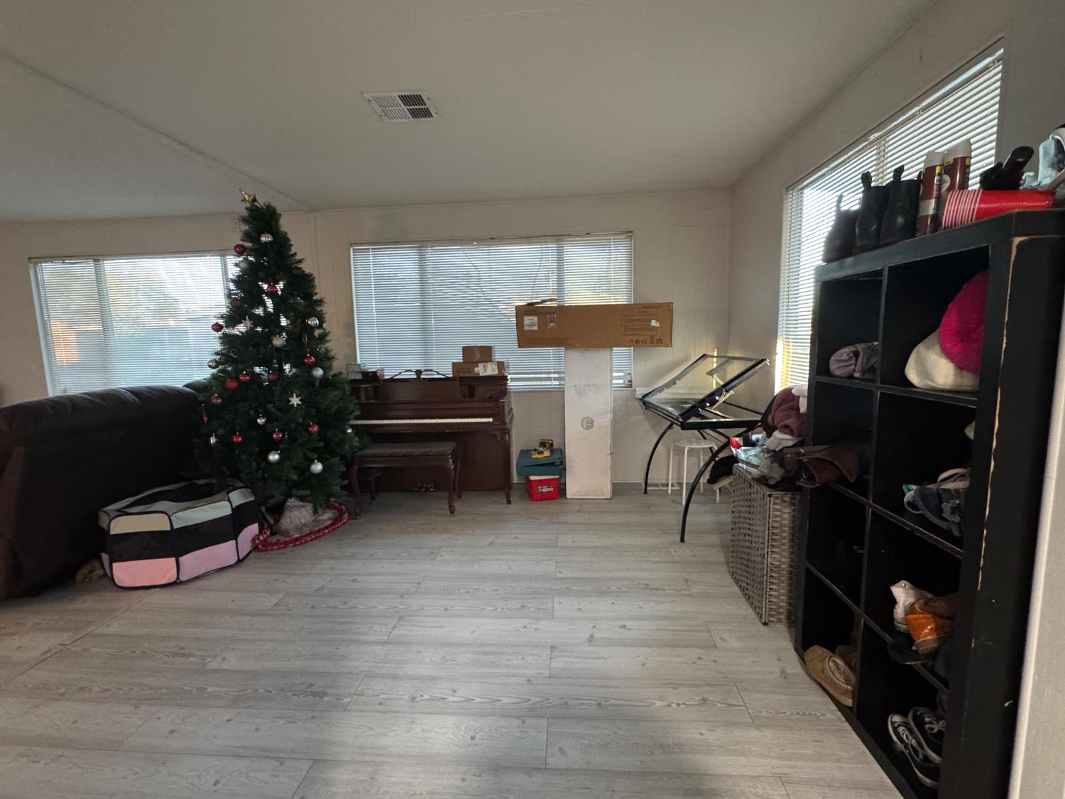 10035 Mills Station Road, Unit 161 Sacramento, CA 95827 - Photo 3 of 15 a living room with furniture a window and potted plant