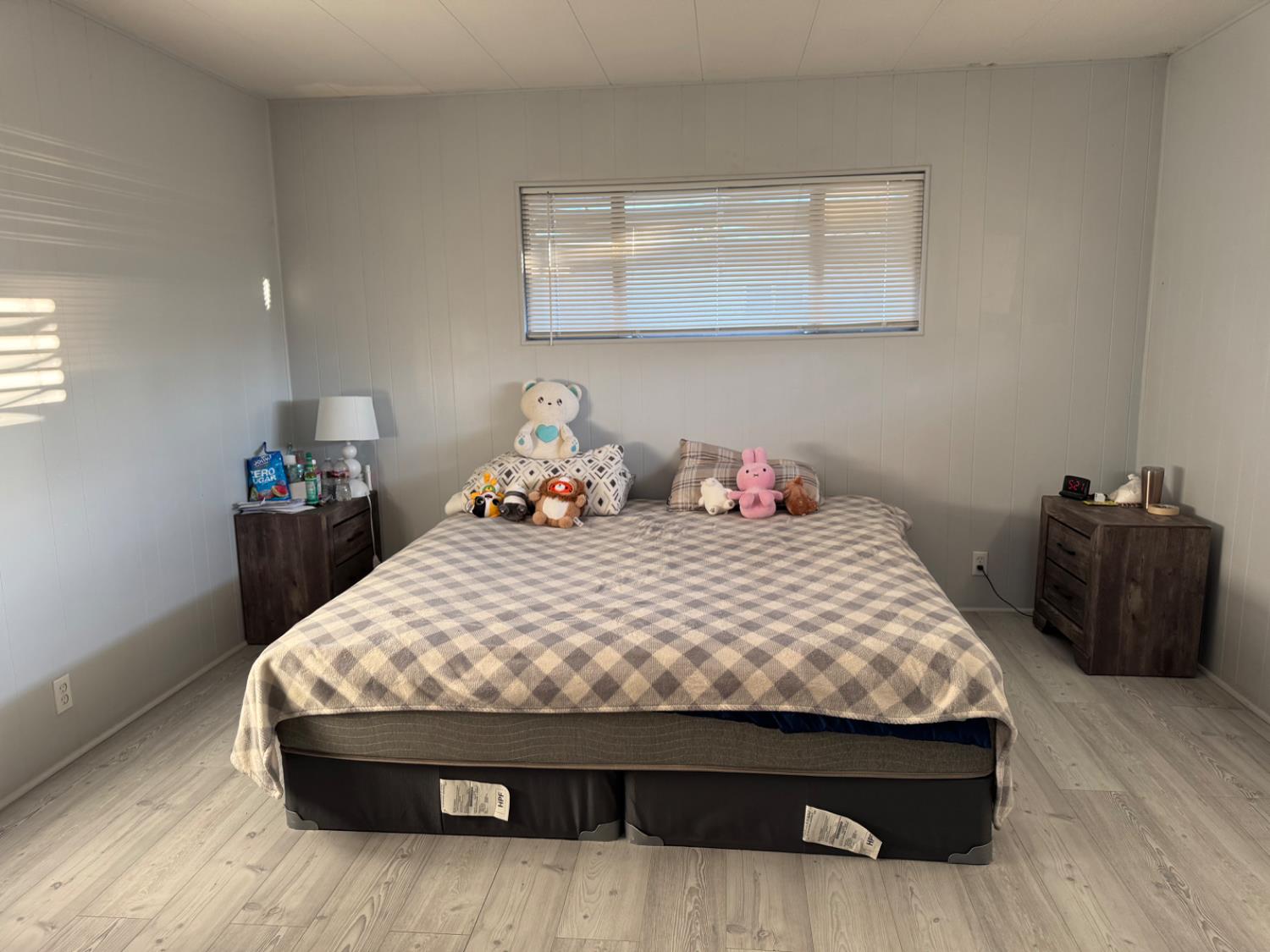 10035 Mills Station Road, Unit 161 Sacramento, CA 95827 - Photo 10 of 15 a bedroom with a bed and a wooden floor