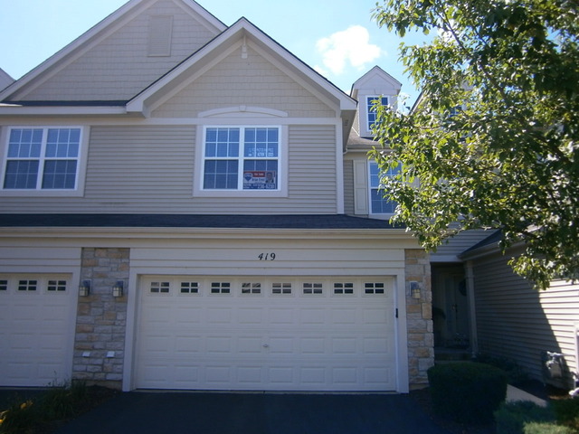 419 Vaughn Circle Aurora, IL 60502 - Photo 1 of 2 a view of a house with a garage
