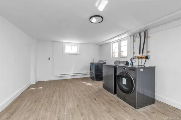 a view of livingroom with washer and dryer