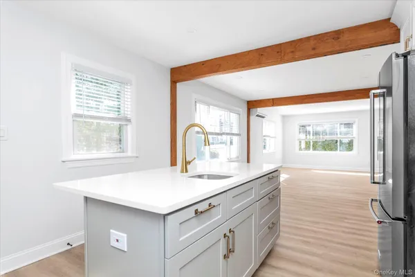 a kitchen with a sink cabinets and window