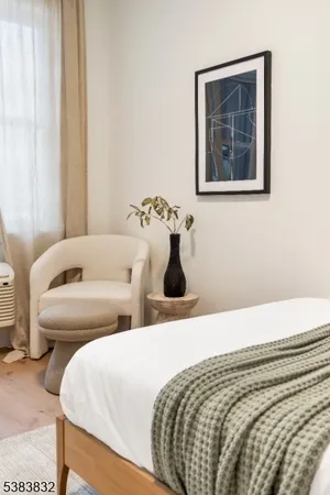 a bedroom with bed and window