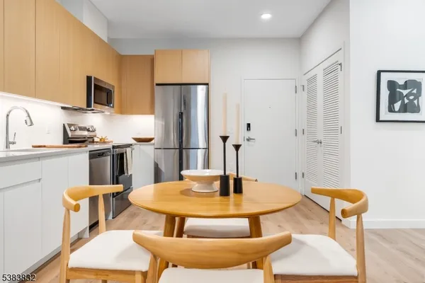a kitchen with a dining table and chairs