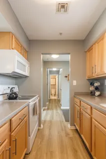 a kitchen with a sink and cabinets
