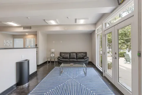 a workspace with furniture and wooden floor