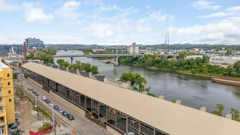a view of balcony with furniture and city view
