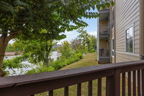 a view of a balcony with a tree