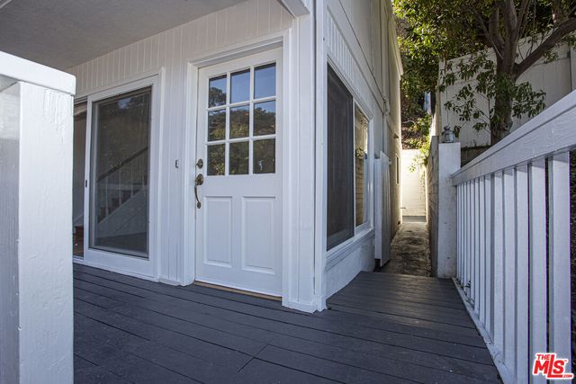 a view of wooden floor and brick walls