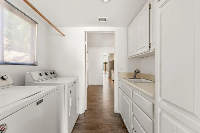 a view of a kitchen sink and a window