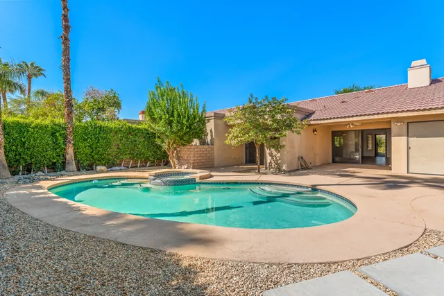 a view of a house with swimming pool