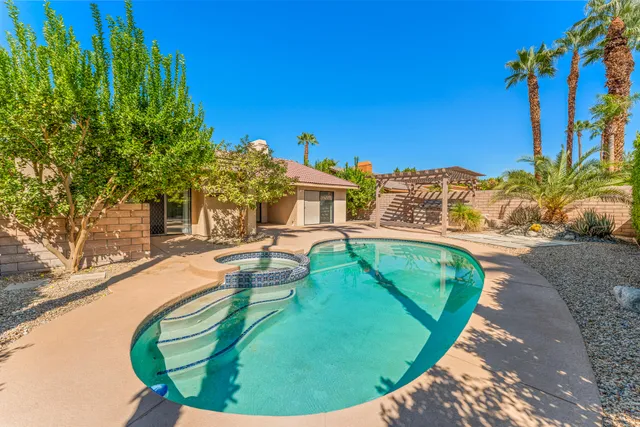 a view of a swimming pool with a patio