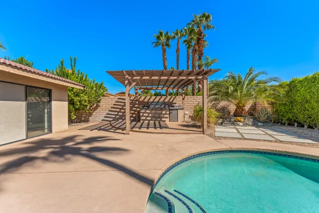 a view of a backyard with a patio