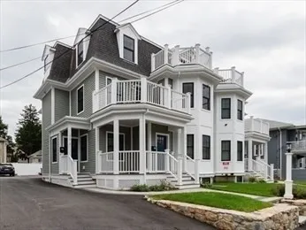 a front view of a building with a yard