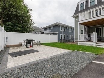 210 Adams Street, Unit 4 Waltham, MA 02453 - Photo 24 of 25 a view of a house with a yard