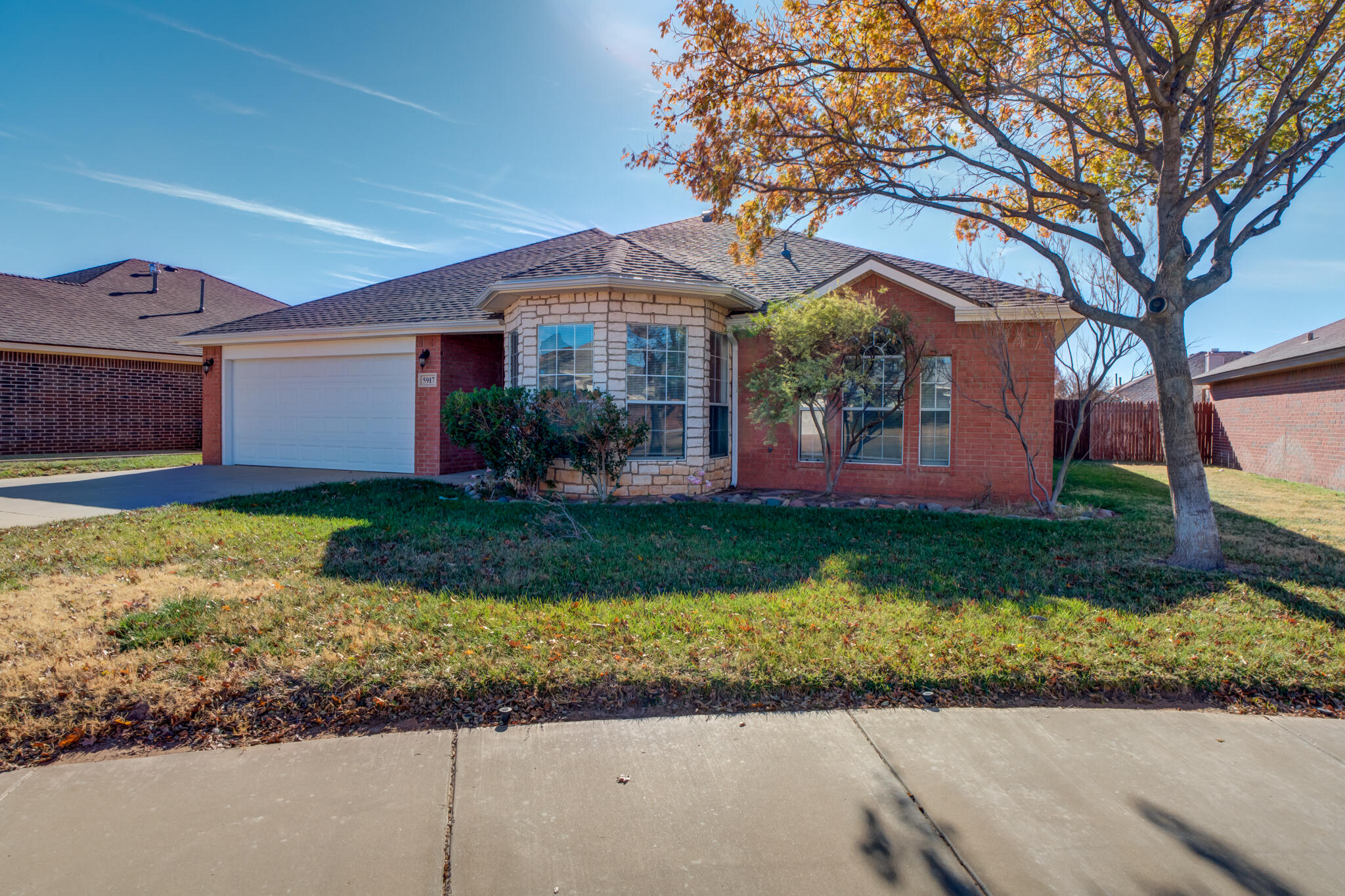 5917 88th Place Lubbock, TX 79424 - Photo 3 of 45 front view of a house with a yard