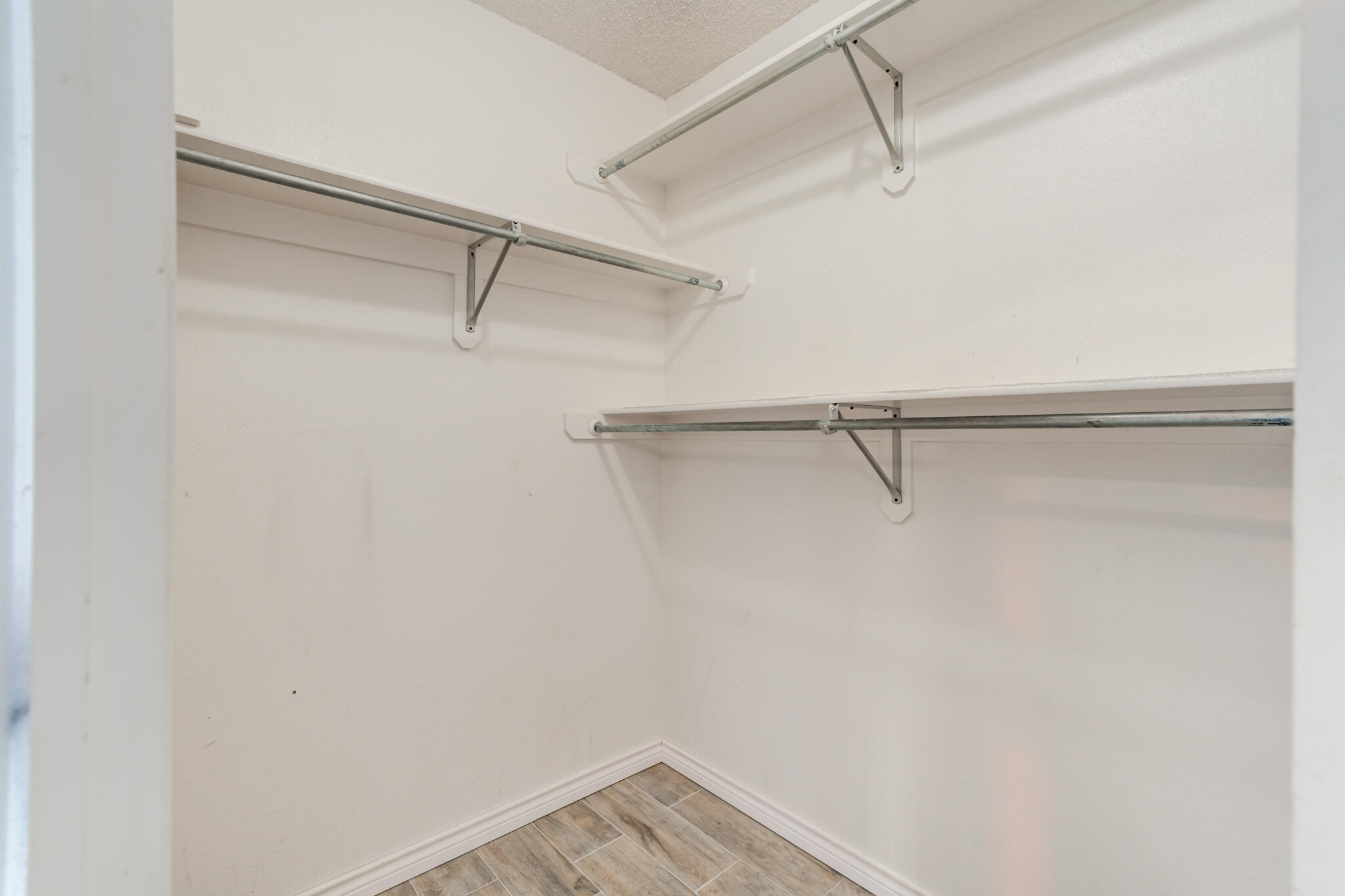 5917 88th Place Lubbock, TX 79424 - Photo 31 of 45 a view of a room with racks on the wall