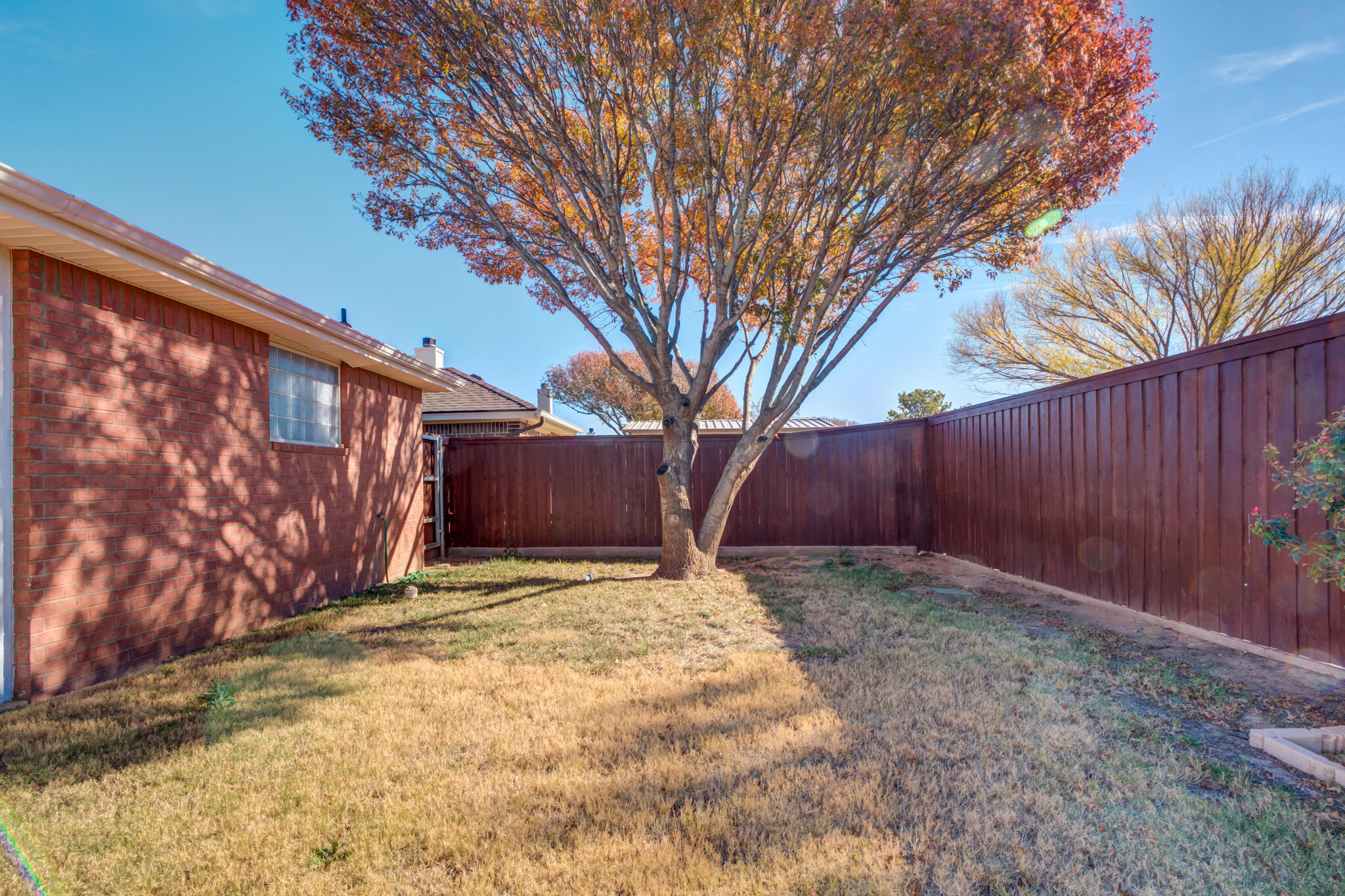 5917 88th Place Lubbock, TX 79424 - Photo 43 of 45 a view of a yard with wooden fence